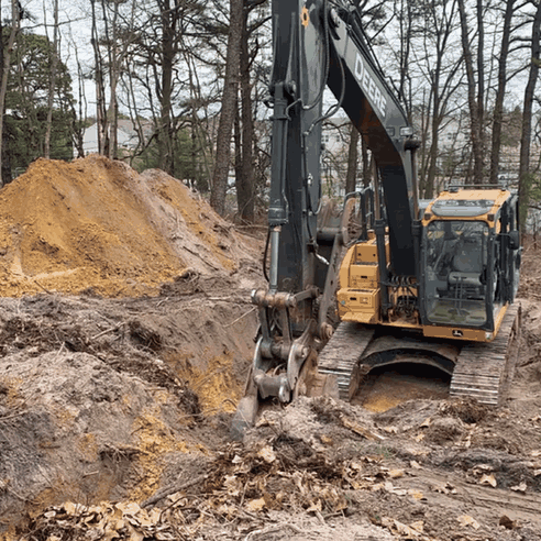 An excavator working on a drainage site